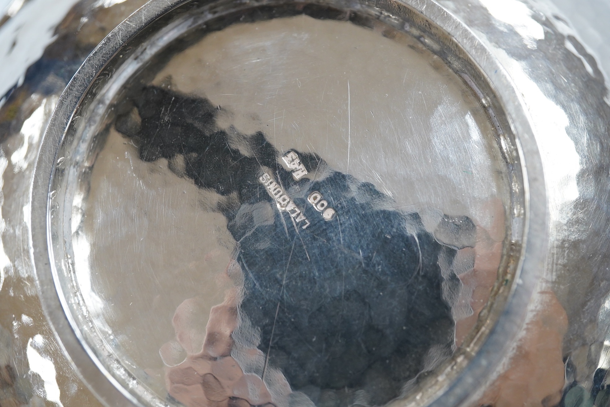 A Greek Lalaounis 800 standard white metal single handled cup, embossed with fish, diameter 11.5cm, 135 grams. Condition - fair